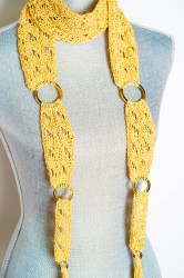 yellow scarf with rings closeup